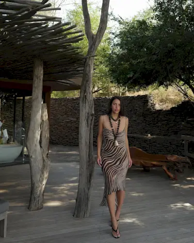 woman wearing sheer printed midi dress summer 2025