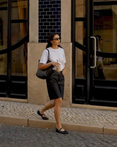 @michellelin.lin wears denim bermuda shorts with a white t-shirt and ballet flats