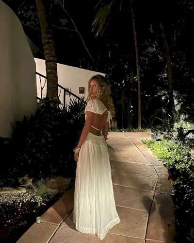 Emili Sindlev in white maxi dress on vacation