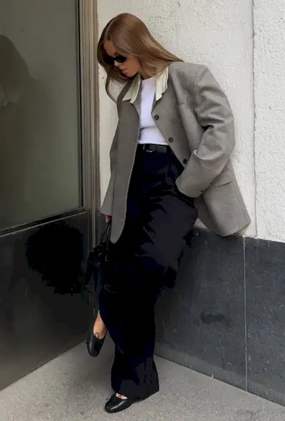 @haaannajohansson wears a grey blazer, white t-shirt, black wide-leg trousers, ballet flats and sunglasses