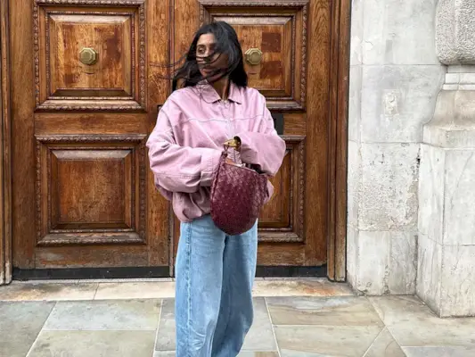 woman wearing jeans and a jacket