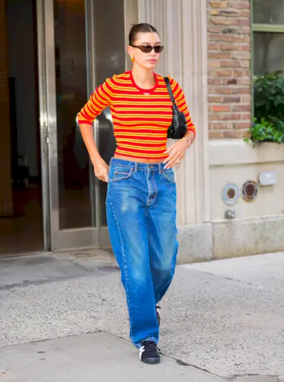 Hailey Bieber wears Black Onitsuka Tiger sneakers.