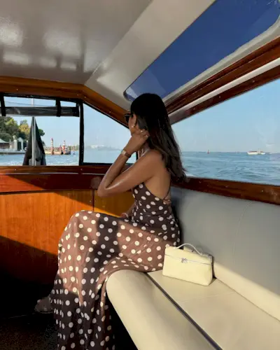 Influencer wears a brown polka dot dress