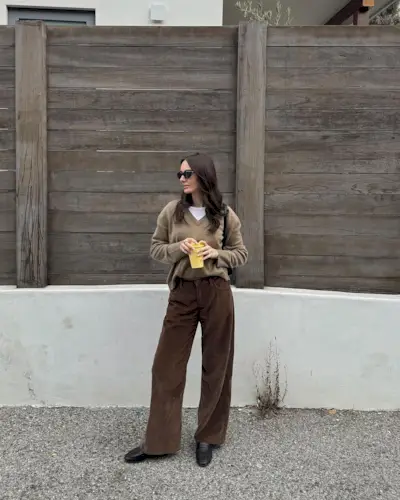 @livvperez wearing brown cords and v-neck jumper