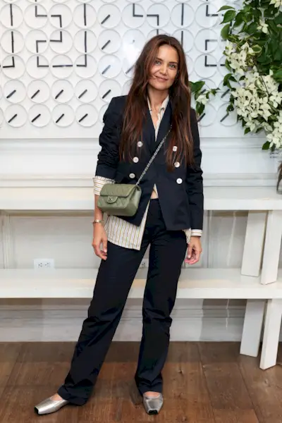 An image of Kaite Holmes wearing silver flats.