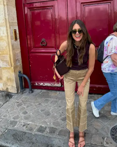 @saraloura wearing khaki pants with a black tank.