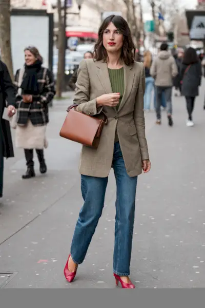 Woman in tweed blazer and straight-leg jeans