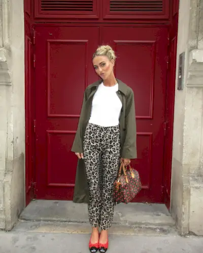 @emilisindlev wearing leopard print trousers, t-shirt and coat