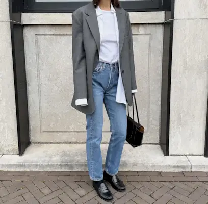 Woman wearing loafers with jeans outfit 2025.