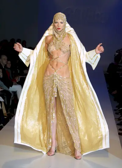 A model wears an outfit from the Bob Mackie fall 2001 collection on February 16, 2001 on the last day of Mercedes-Benz Fashion Week at Bryant Park in New York City.