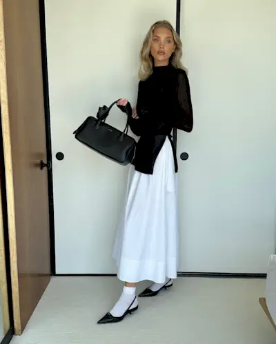 An image of Elsa Hosk wearing one of the biggest skirt trends of 2025.