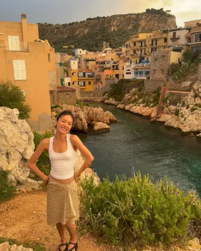 Summer 2025 skirt trends: @ginacho23 wears a scarf skirt with a tank top