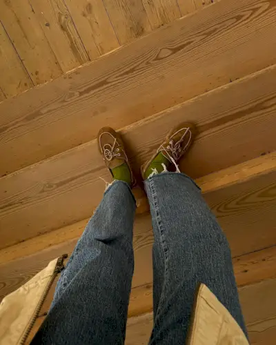 Influencer wears boat shoes.