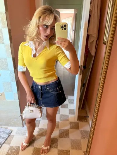 An image of @sabrinacarpenter wearing the Miu Miu Vernice bag, one of the best Miu Miu bags.