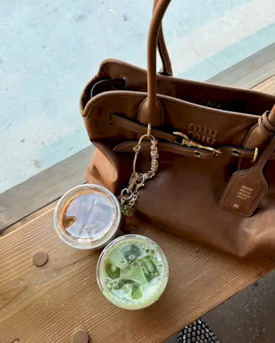 An image of @aliwhittle_ wearing the Miu Miu Adventure bag, one of the best Miu Miu bags.