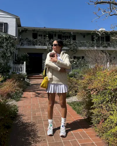 @aimeesong wearing New Balance with a white tennis skirt