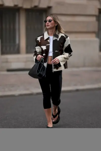 Influencer wears the cow print fashion trend.