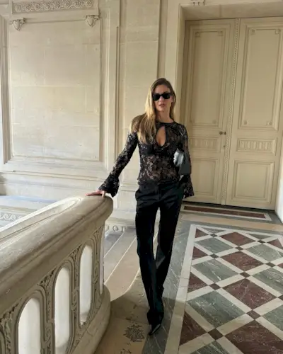 Anne-Laure Mais wearing skinny pants and pointed-toe ankle boots.