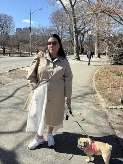 Photo of editor Ana Escalante reviewing New Balance 574 sneakers