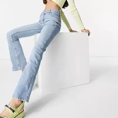 ASOS Design + Low Rise Comfort Stretch Flare Jeans in Vintage Mid-Wash
