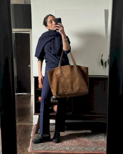 woman wearing a navy sweater