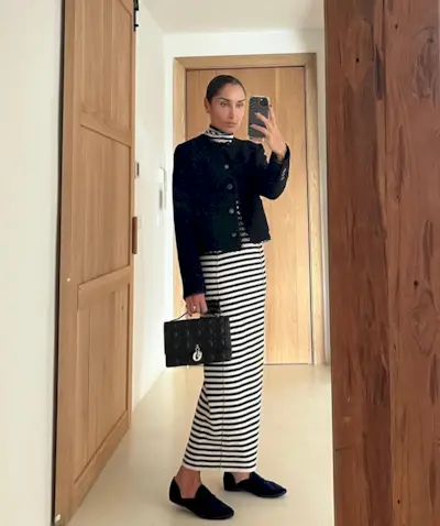 woman wearing a black collarless jacket