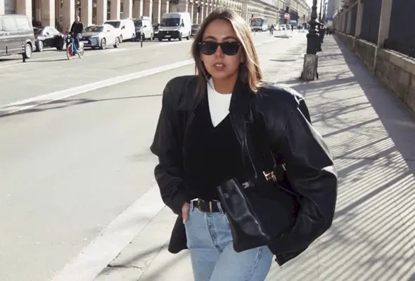 Hanna MW wearing a leather jacket and jeans