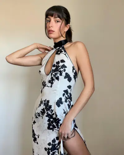 Woman wearing a black-and-white floral-print dress.