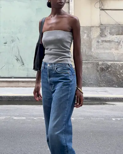 woman wearing tube top and jeans