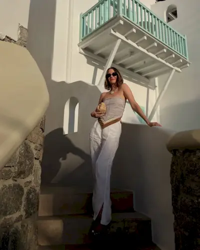woman wearing tube top and white pants