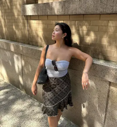 woman wearing tube top and midi skirt