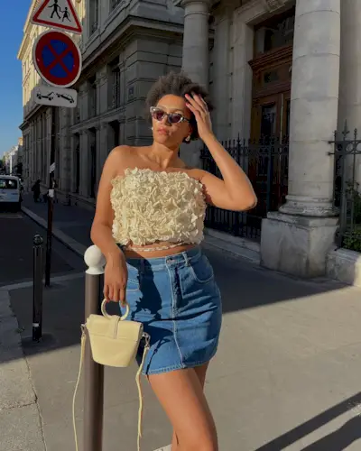 woman wearing tube top and denim skirt
