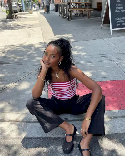 woman wearing striped tube top and pants