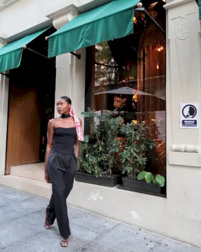 woman wearing black tube top and trousers