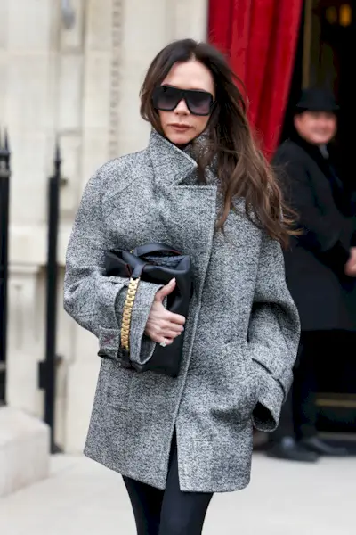 An image of Victoria Beckham wearing one of the best clutch bags.