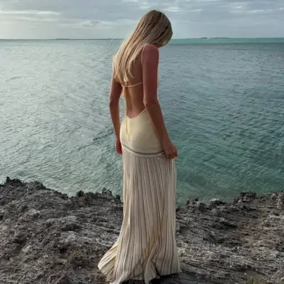 An image of @caitlinburnhamm wearing one of the key summer dress trends for 2025.