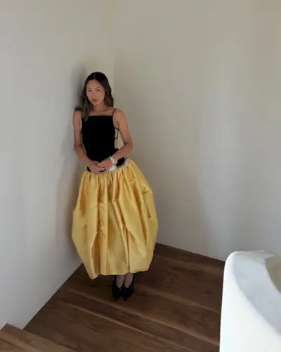 An image of @aimeesong wearing one of the key summer dress trends for 2025.