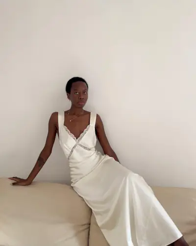 An image of @sylviemus_ wearing one of the key summer dress trends for 2025.