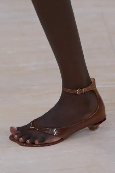 Chloe model wearing jelly sandals.