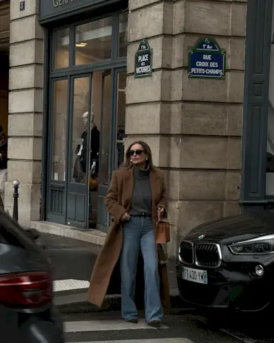 Influencer wears a funnel neck jumper.