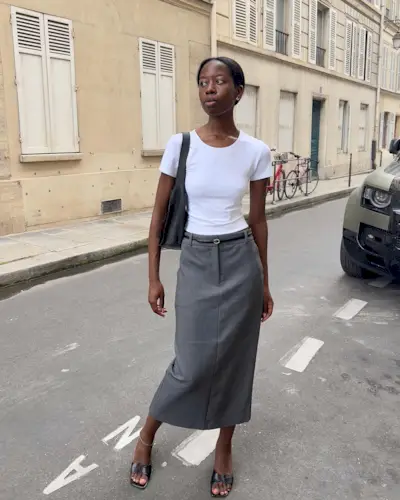 Sylvie Mus styles a grey pencil skirt with a whit t-shirt and mules.