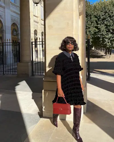 Influencer wears burgundy boots