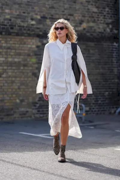 Woman in button down and lace skirt