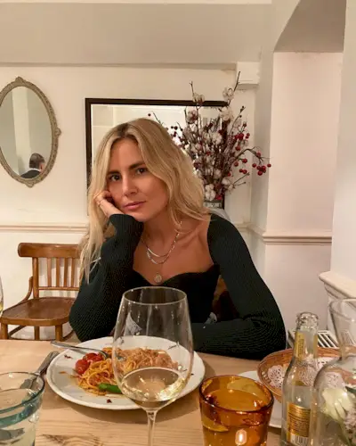 Lucy Williams sitting down at a resturant.