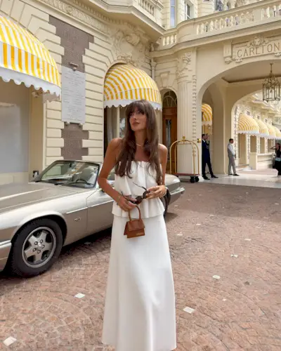 Influencer wears a white strapless top.