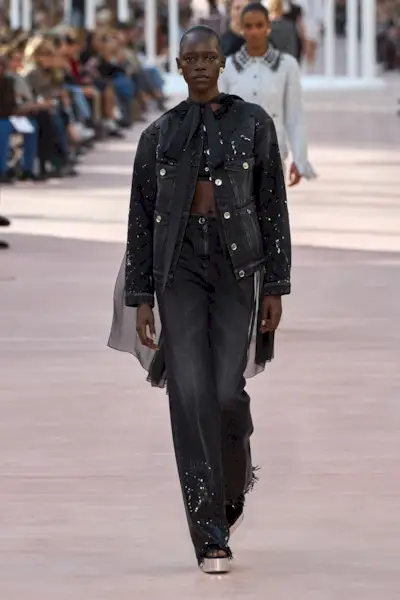 Model wears embellished jeans on the Chanel Spring/Summer 2025 runway.