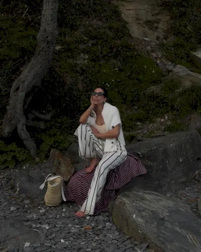 striped-pant outfit with swimsuit and sweater