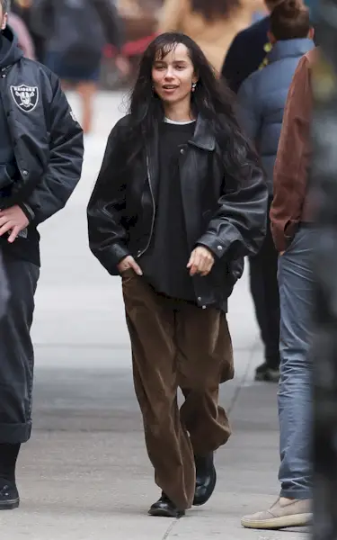 04/21/2025: Zoe Kravitz is spotted out with a male friend in New York City. The American actress wore a black leather jacket, dark brown corduroy trousers, and black boots.