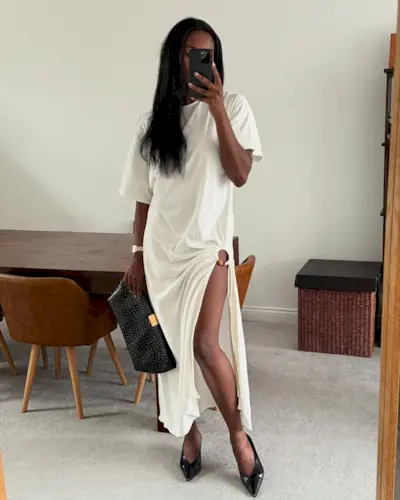 @nlmarilyn wearing a white T-shirt dress with kitten-heel pumps.