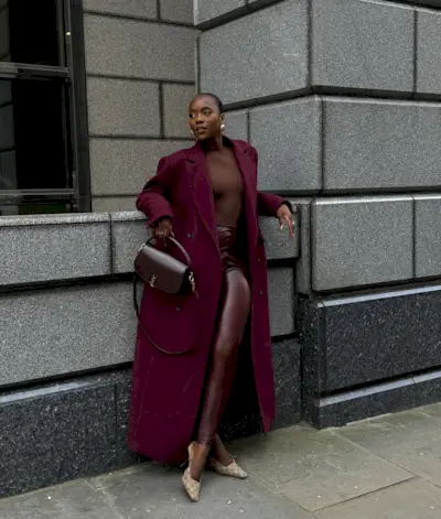 Flora in burgundy red leggings and outfit